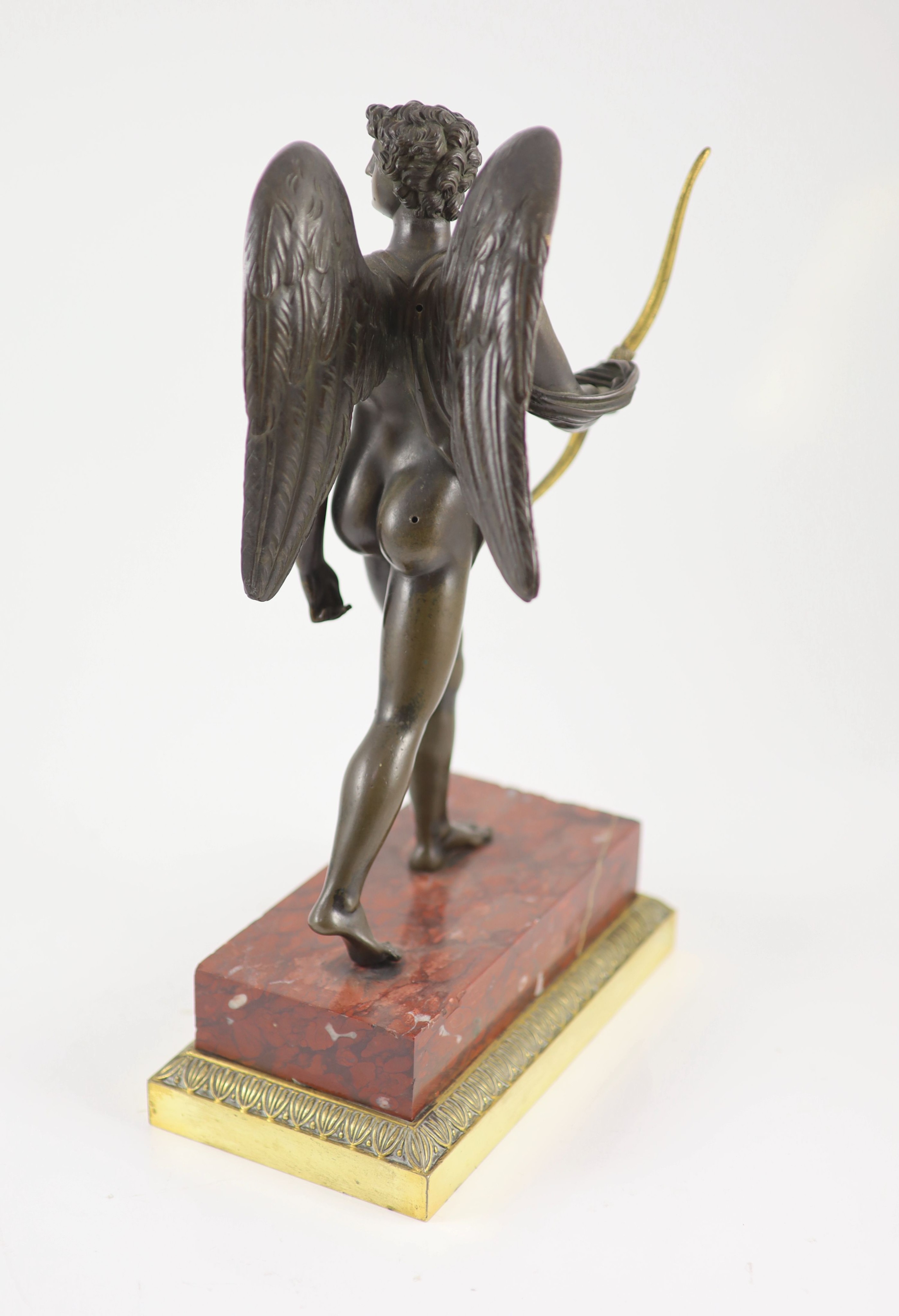 A 19th century bronze figure of Eros, H 37cm. W 22cm. D 12cm.